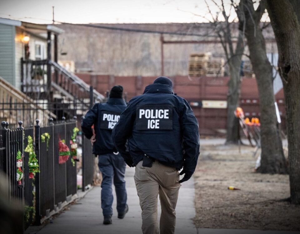 US Immigration and Customs Enforcement (ICE) agents walk down a street during a multi-agency targeted enforcement operation in Chicago, Illinois, US, on Sunday, Jan. 26, 2025.
