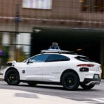 A white Waymo vehicle