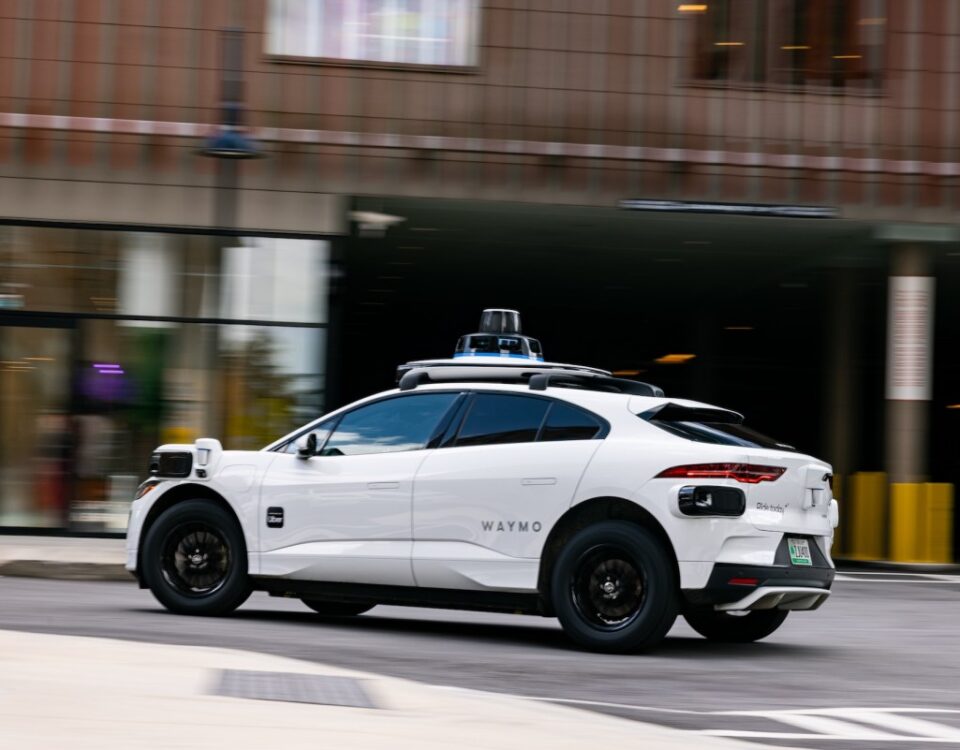 A white Waymo vehicle