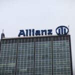a photo of Allianz's logo at the top of a building.