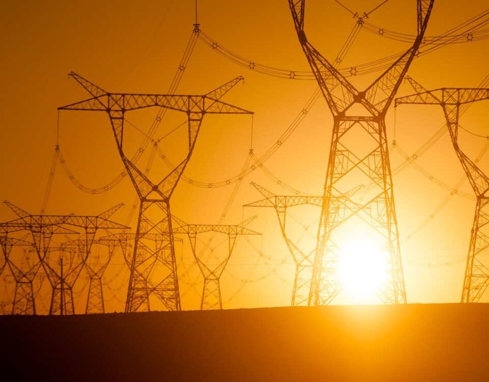 Silhouetted electricity pylon grid