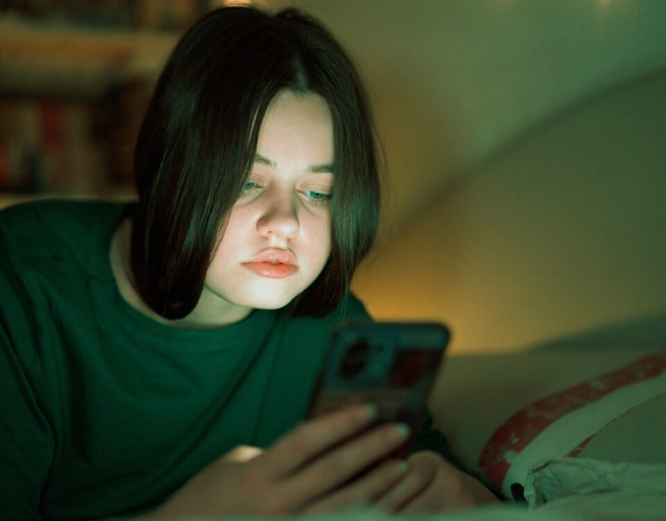 Portrait of a teenage girl looking at her mobile phone.