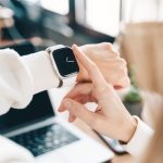 Modern woman using smart watch for daily tasks, interacting with the touchscreen user interface. Tracking health habits, messaging, checking on time with simple application software.