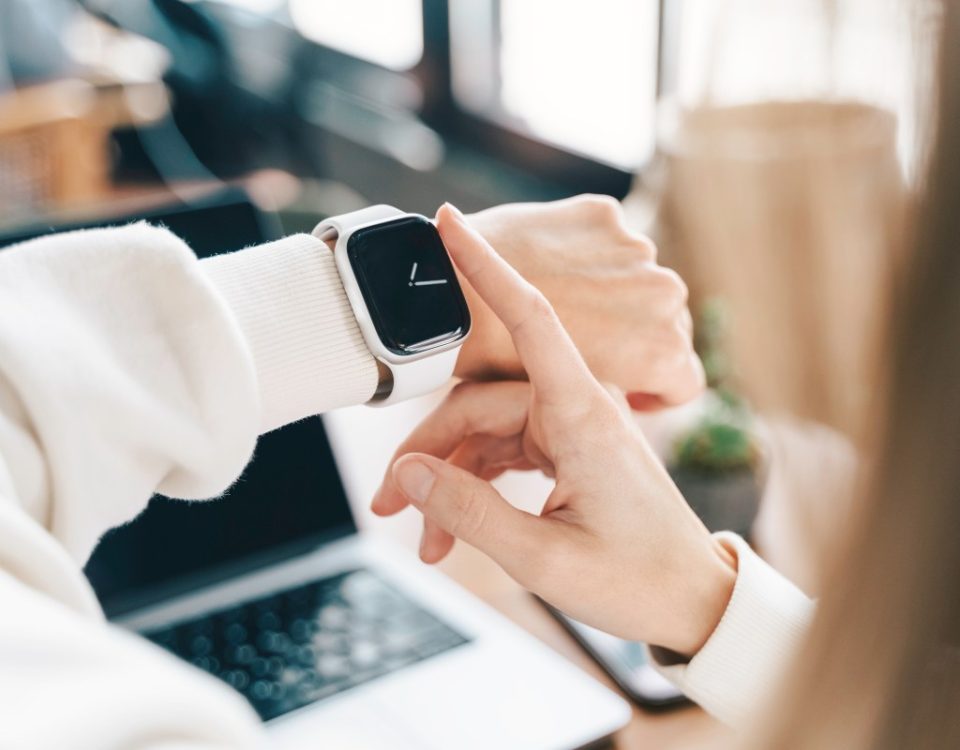 Modern woman using smart watch for daily tasks, interacting with the touchscreen user interface. Tracking health habits, messaging, checking on time with simple application software.