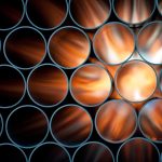 Pipes are backlit, causing them to appear to glow orange.