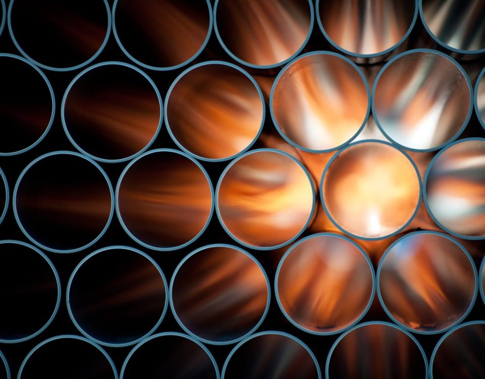 Pipes are backlit, causing them to appear to glow orange.