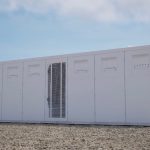 A rendering shows Tesla's Megablock energy storage system.