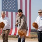 Governor Brian Kemp and Rivian CEO RJ Scaringe break ground at the planned Georgia factory.