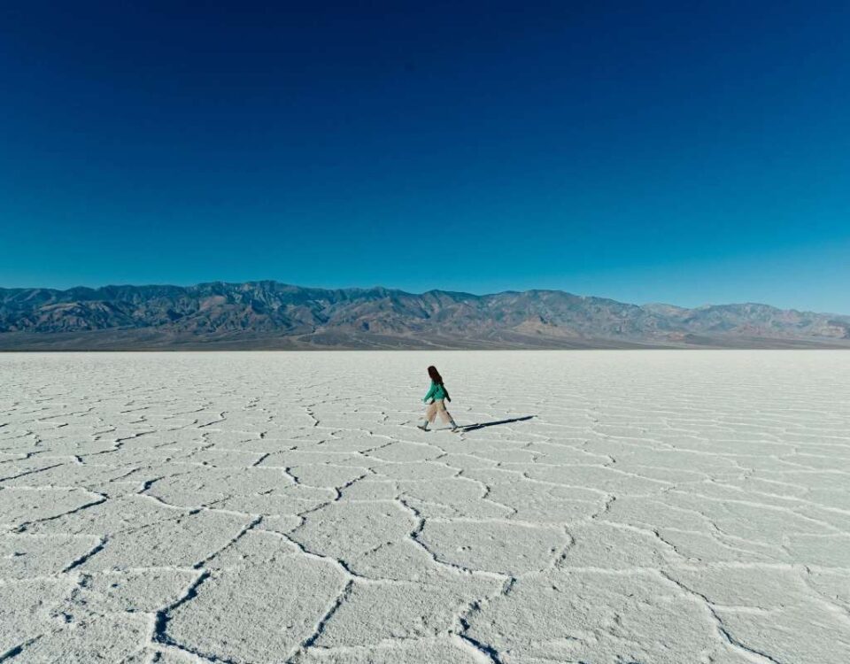 Woman walking on a salt flat.