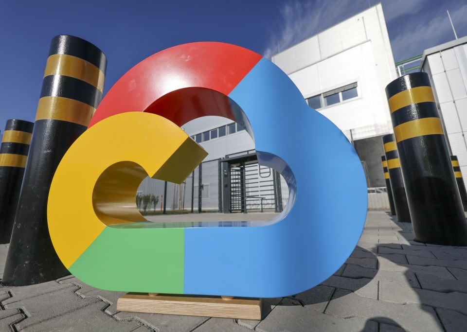 A Google Cloud logo outside the Google Cloud data center ahead of its ceremonial opening in Hanau, Germany, on Friday, Oct. 6, 2023. Microsoft Corp., Alphabet Inc.'s Google and ChatGPT maker OpenAI use cloud computing that relies on thousands of chips inside servers in massive data centers across the globe to train AI algorithms called models, analyzing data to help them learn to perform tasks. Photographer: Alex Kraus/Bloomberg via Getty Images