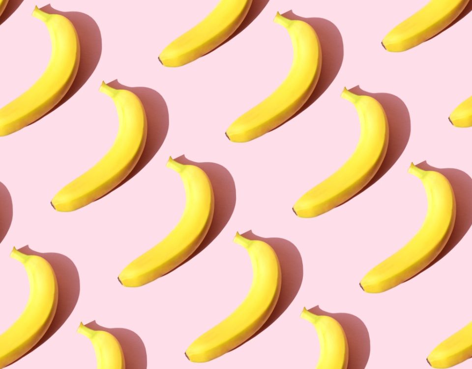 Repeated banana on the pink background