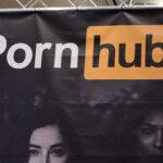 A sign hangs at the Pornhub booth at the 2023 AVN Adult Entertainment Expo at Resorts World Las Vegas on January 06, 2023 in Las Vegas, Nevada.