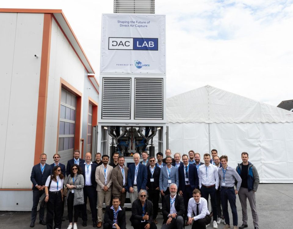The DACLab team stands in front of one of their direct air capture units.