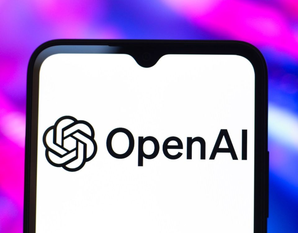 The OpenAI logo is seen displayed on a smartphone screen.