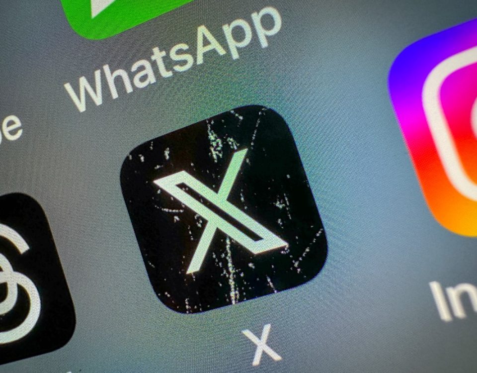 X icon on a smartphone screen