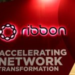 a photo showing Ribbon Communicatons' signage on a red background