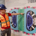 Alex Creely, director of Tokamak operations at Commonwealth Fusion Systems, points to a reactor schematic.