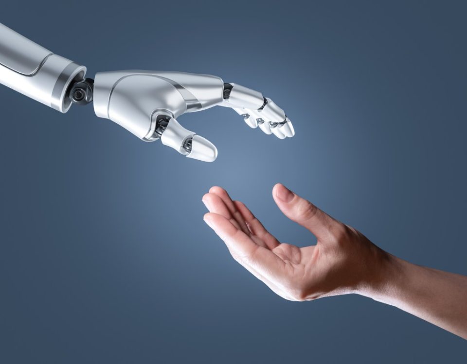 image of a humanoid hand reaching out to a human hand