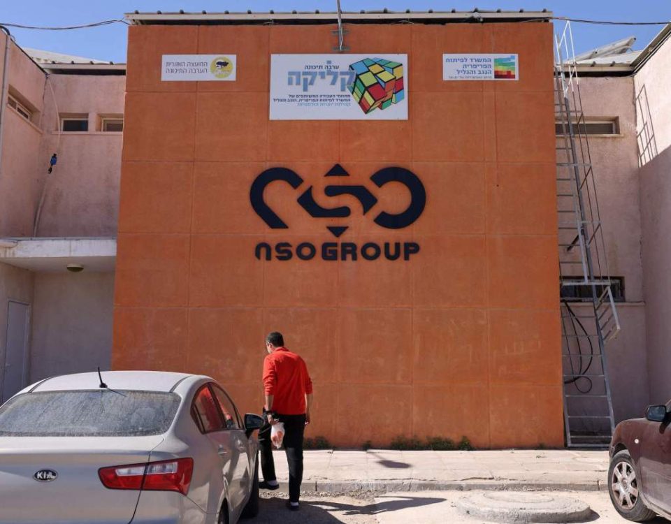 The NSO Group company logo is displayed on a wall of a building next to one of their branches in the southern Israeli Arava valley near Sapir community centre on February 8, 2022. - Israel's domestic spying scandal widened yesterday, with Prime Minister Naftali Bennett vowing government action following new reports that police illegally used the Pegasus malware to hack phones of dozens of prominent figures. (Photo by MENAHEM KAHANA / AFP) (Photo by MENAHEM KAHANA/AFP via Getty Images)