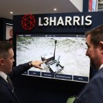 Representatives present a defense system at the L3Harris stand during the 33rd International Defence Industry Exhibition (MSPO) in Kielce, Poland, on September 2, 2025.