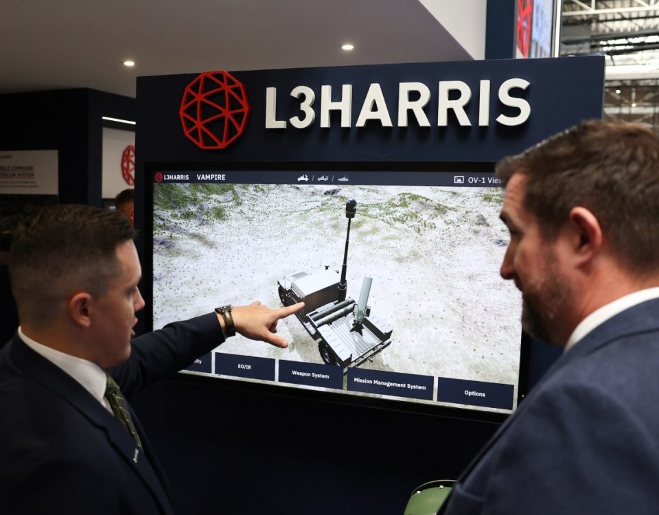 Representatives present a defense system at the L3Harris stand during the 33rd International Defence Industry Exhibition (MSPO) in Kielce, Poland, on September 2, 2025.