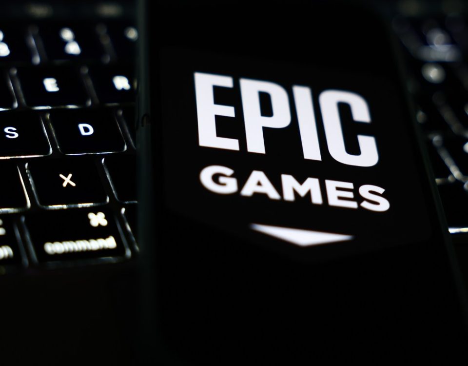 A laptop keyboard and Epic Games logo displayed on a phone screen are seen in this illustration photo taken in Krakow, Poland on October 1, 2024. (Photo by Jakub Porzycki/NurPhoto via Getty Images)