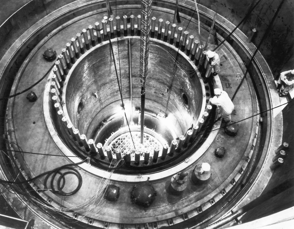 Engineers look inside a nuclear reactor.