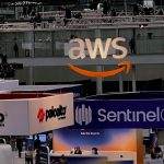 Conference floor with booths from companies like AWS, Palo Alto Networks, Rapid 7 and others taken from above.