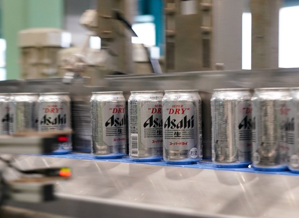 Cans of Asahi Super Dry beer move on the production line inside the Asahi Breweries Ibaraki plant, operated by Asahi Breweries Ltd., a unit of Asahi Group Holdings Ltd., in Moriya, Ibaraki Prefecture, Japan, on Tuesday, April 25, 2023.