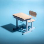 Empty school desk on a blue background. .