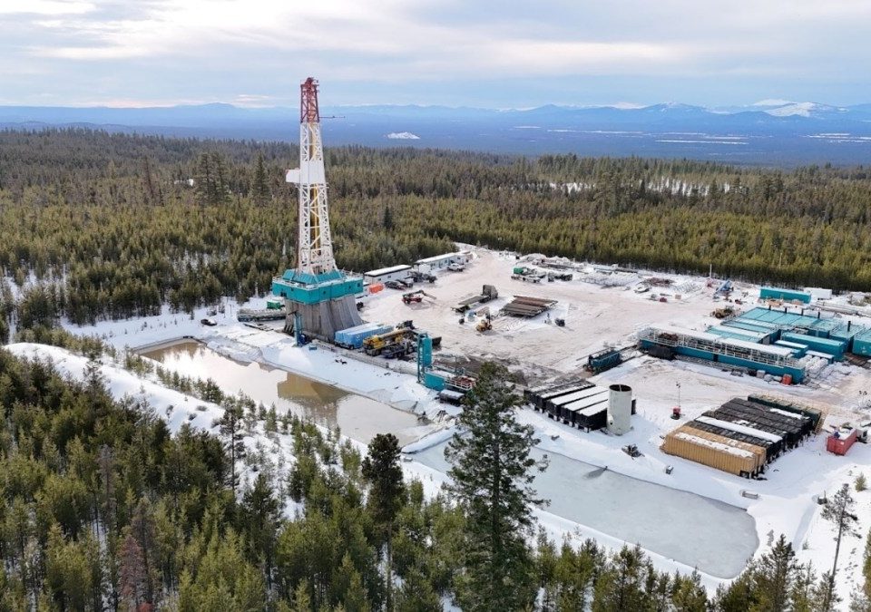 A geothermal drilling rig sits in a forest in Oregon.