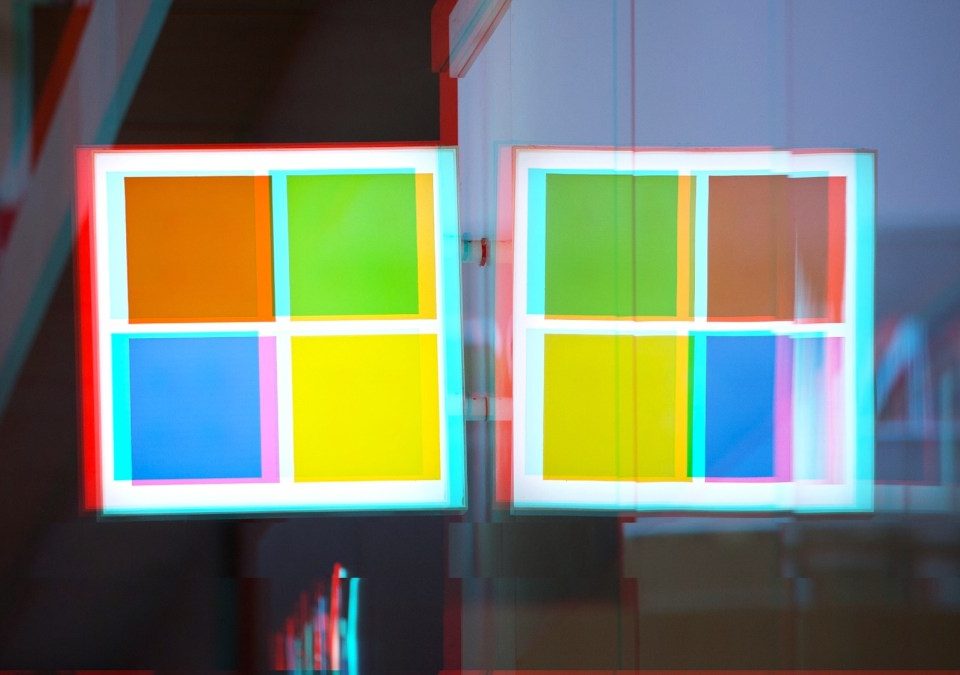 a moshed/glitchy version of a Windows logo on a Microsoft Store front